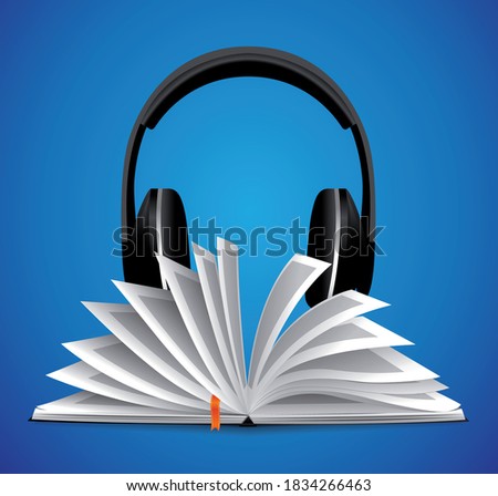 Audiobook concept - opened book with headphones