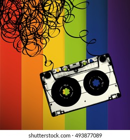 Audiocassette tape with tangled. On rainbow stripes background