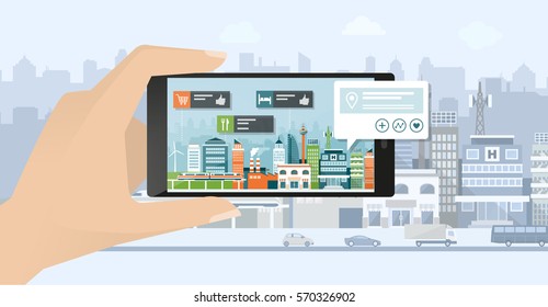 Augmented reality, navigation and location concept: hand holding a smartphone and viewing a city street, the user is searching places using an app