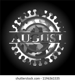 August written on a grey camouflage texture