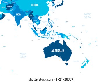 Australia and Southeast Asia map - green hue colored on dark background. High detailed political map of australian and southeastern Asia region with country, capital, ocean and sea names labeling.