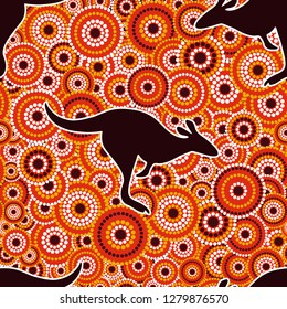 Australian aboriginal art seamless vector pattern with multicolored dotted circles and black kangaroo