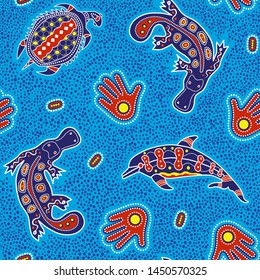 Australian aboriginal art seamless vector pattern with colorful dolphin, turtle, platypus, palm and other typical elements on dotted background or texture