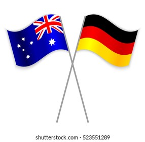 Australian and German crossed flags. Australia combined with Germany isolated on white. Language learning, international business or travel concept.