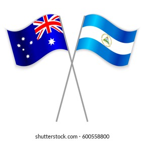 Australian and Nicaraguan crossed flags. Australia combined with Nicaragua isolated on white. Language learning, international business or travel concept.