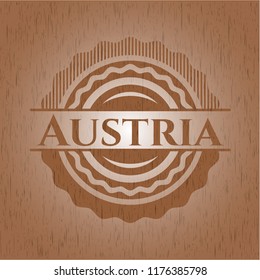 Austria badge with wooden background