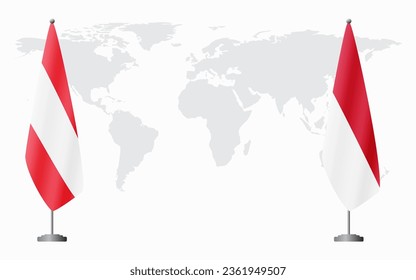 Austria and Monaco flags for official meeting against background of world map.