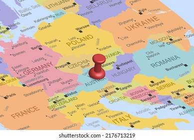 Austria with red fastener pushpin on europe map, close up Austria, pinned destination, travel idea, colorful map with location icon, vacation and road trip concept, top view