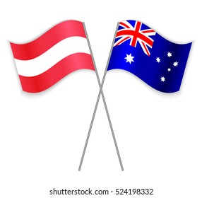 Austrian and Australian crossed flags. Austria combined with Australia isolated on white. Language learning, international business or travel concept.