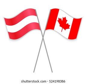 Austrian and Canadian crossed flags. Austria combined with Canada isolated on white. Language learning, international business or travel concept.