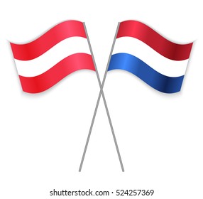 Austrian and Dutch crossed flags. Austria combined with Netherlands isolated on white. Language learning, international business or travel concept.