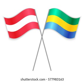 Austrian and Gabonese crossed flags. Austria combined with Gabon isolated on white. Language learning, international business or travel concept.