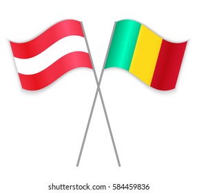 Austrian and Guinean crossed flags. Austria combined with Guinea isolated on white. Language learning, international business or travel concept.