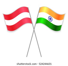 Austrian and Indian crossed flags. Austria combined with India isolated on white. Language learning, international business or travel concept.