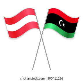 Austrian and Libyan crossed flags. Austria combined with Libya isolated on white. Language learning, international business or travel concept.