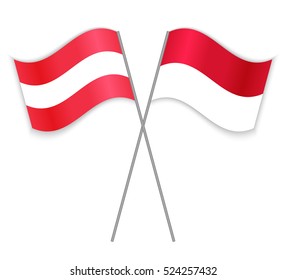 Austrian and Monegasque crossed flags. Austria combined with Monaco isolated on white. Language learning, international business or travel concept.