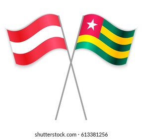 Austrian and Togolese crossed flags. Austria combined with Togo isolated on white. Language learning, international business or travel concept.