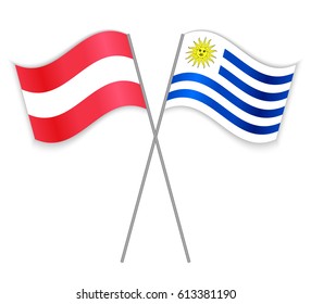 Austrian and Uruguayan crossed flags. Austria combined with Uruguay isolated on white. Language learning, international business or travel concept.