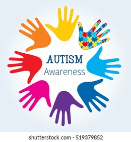 Autism awareness concept with hand of puzzle pieces as symbol of autism.