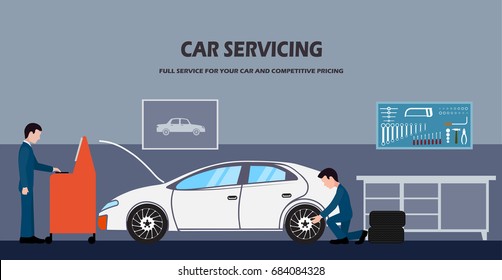 Auto repair shop workers behind repair of a car.