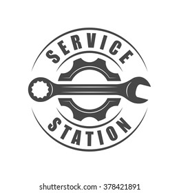 Auto service logotype, wrench and gear silhouette
