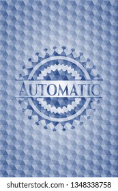 Automatic blue badge with geometric background.