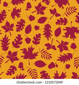 Autumn background. Fall leaves seamless vector pattern. Dark pink leaf silhouettes on orange. Acorns, oak tree, maple tree pattern. Fall background, Thanksgiving card, Seasonal prints, November, paper