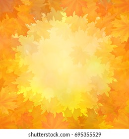 Autumn background with a frame of fallen maple leaves in a circle.