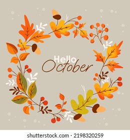 autumn background with the inscription hello october and a crown of autumn leaves of berries and acorns