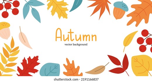 Autumn background with leaves, acorns and rowan