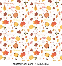 Autumn background with autumn leaves rowan acorns and pumpkin. Bright colorful.