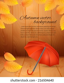 Autumn background with leaves and an umbrella.