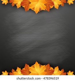 Autumn background with autumn maple leaves on blackboard. Back to school.