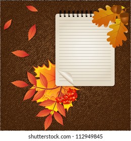 Autumn background with notepad and leaves