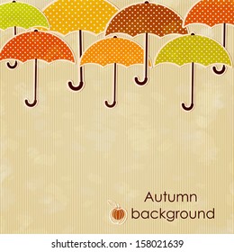 Autumn background with umbrellas