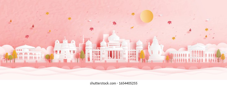 Autumn in Bengaluru, India with falling maple leaves and world famous landmarks in paper cut style vector illustration