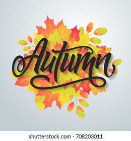 Autumn. Bright abstract background with leaves. Modern handmade vector lettering.