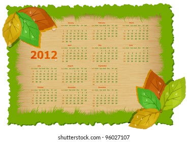 Autumn calendar year in frame of green grass