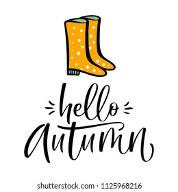 Autumn calligraphy card with rain boots. "Hello autumn" hand written text.