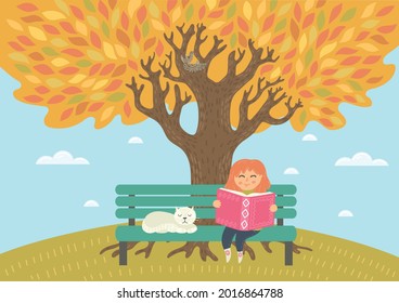 Autumn. Child reading book. Cute little girl sits on  bench under big tree and enjoy fall.