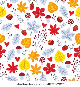 Autumn colorful seamless pattern with leaves, hazelnuts, mushrooms and acorns
