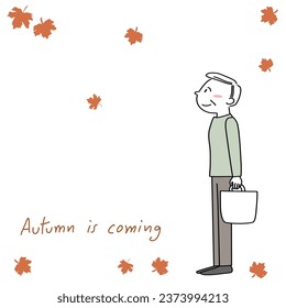 Autumn is coming theme with happy mature man looking at falling leaves while walking. Senior man smiling and watching fall foliage. Fall foliage greeting card with elderly man watching falling leaves.