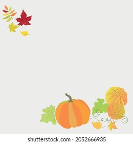Autumn composition of ripe pumpkins and colorful fallen leaves on a white background