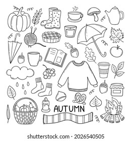 Autumn doodle set. Pumpkin, sweater, falling leaves, basket, tea, strawberries, mushrooms, book, umbrella. Hand drawn vector illustration isolated on white background. 