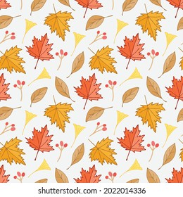 Autumn dry maple leaves and ginkgo leaf and berries seamless pattern background