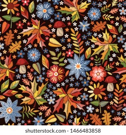 Autumn embroidered print. Seamless pattern with embroidery of flowers and leaves. Colorful design for fall season.
