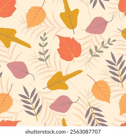 Autumn fall foliage seamless pattern of autumn color leaves. Composite floral surface design of fall colored poplar, palm etc. leaves on papaya whip color background.