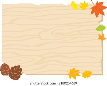 Autumn fallen leaves and wooden bulletin board.