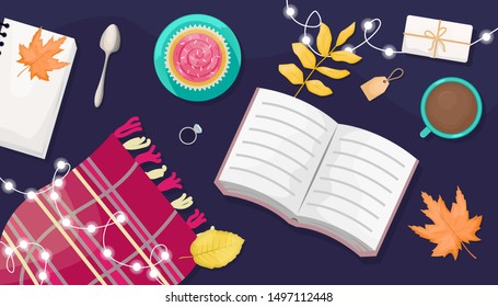 Autumn flat lay with the book, lights, wool scarf, coffee and autumn leaves.