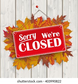 Autumn foliage with red hanging sign and text "sorry, we're closed".  Eps 10 vector file.